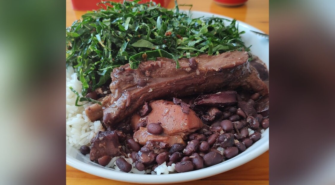 Feijoada — Brazilian black bean and smoked pork stew over rice with collard greens